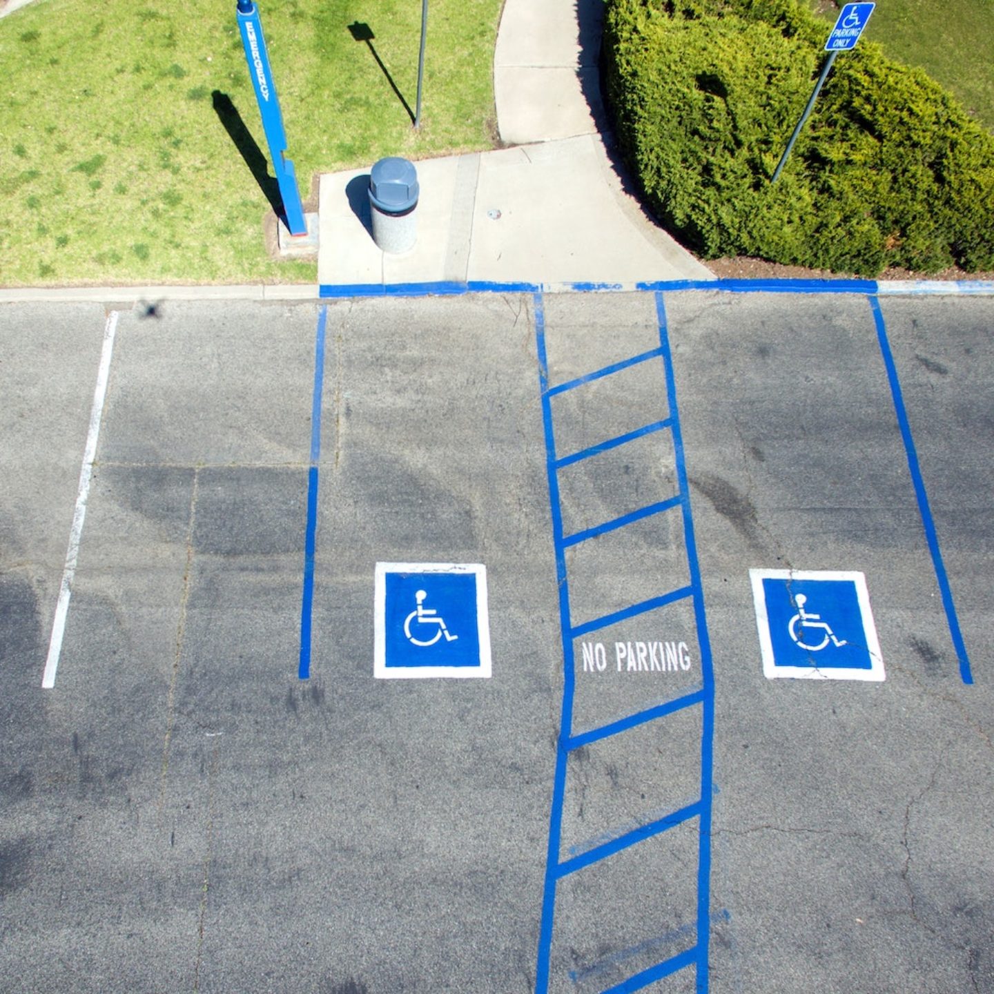 parking lot with international symbol of access and access ways painted